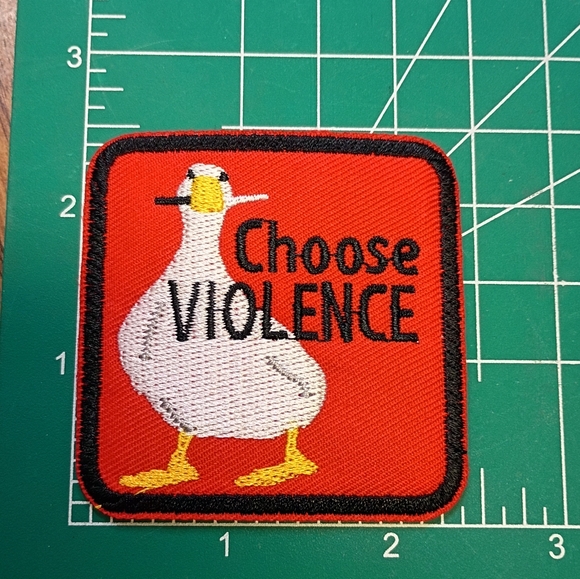 Hot Topic Accessories - 2/$10 Red Duck Patch with Choose Violence Text